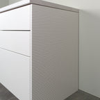 Rhythm side panel in white lacquer on a kitchen cabinet, angled view