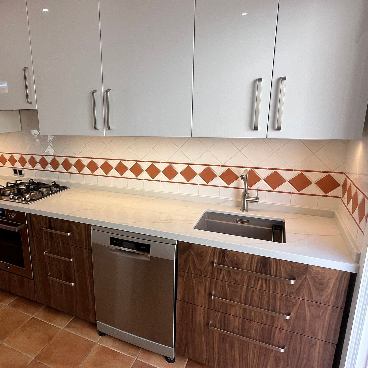 IKEA METOD kitchen with American walnut veneer fronts on the base drawers, customer project