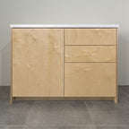 Kitchen cabinet with birch plywood fronts, a door and three drawers, front view