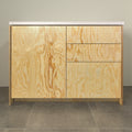 Kitchen cabinet with pine plywood fronts, a door and three drawers, front view