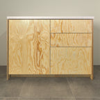 Kitchen cabinet with pine plywood fronts, a door and three drawers, front view