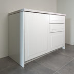 Hampton fronts in white lacquer on a kitchen cabinet, angled view from the left