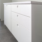 Round fronts on a kitchen cabinet, angled view from the right