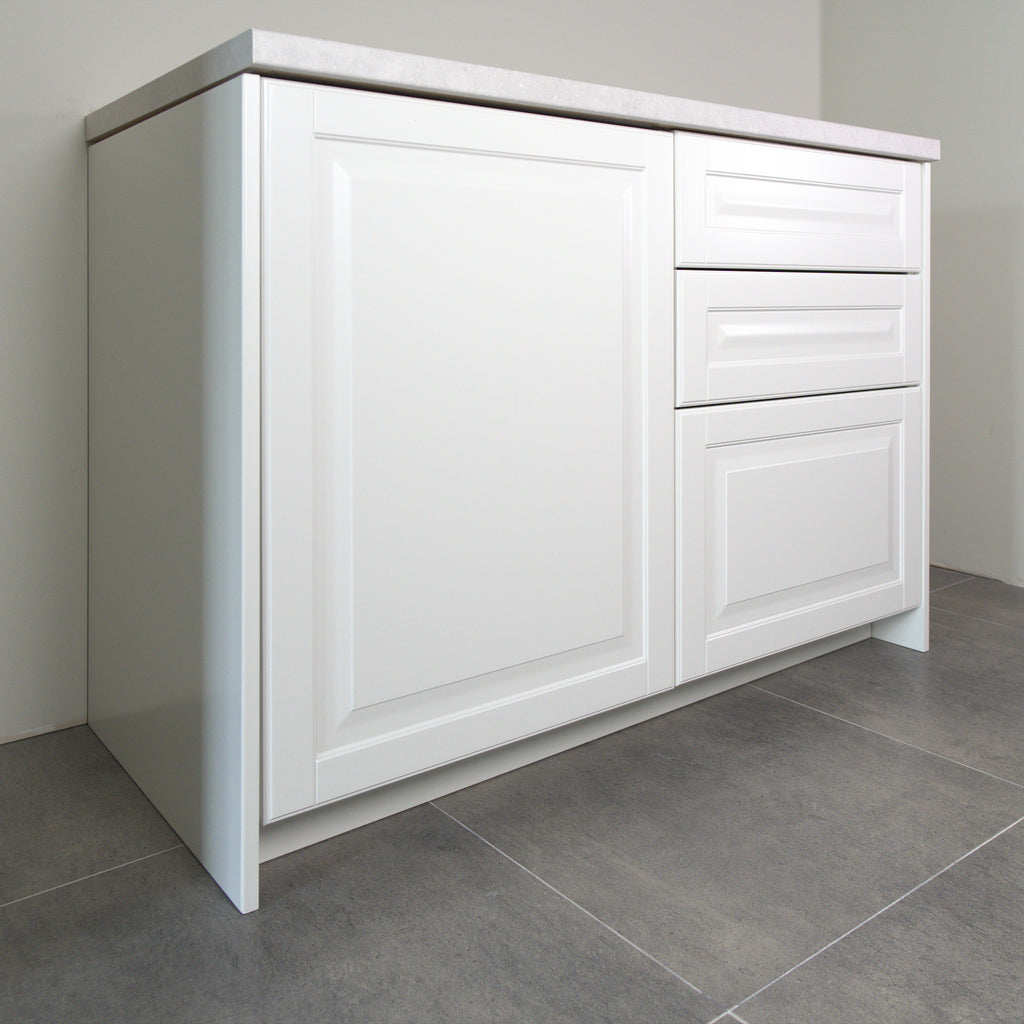 Vienna fronts in white lacquer on a kitchen cabinet, angled view from the left