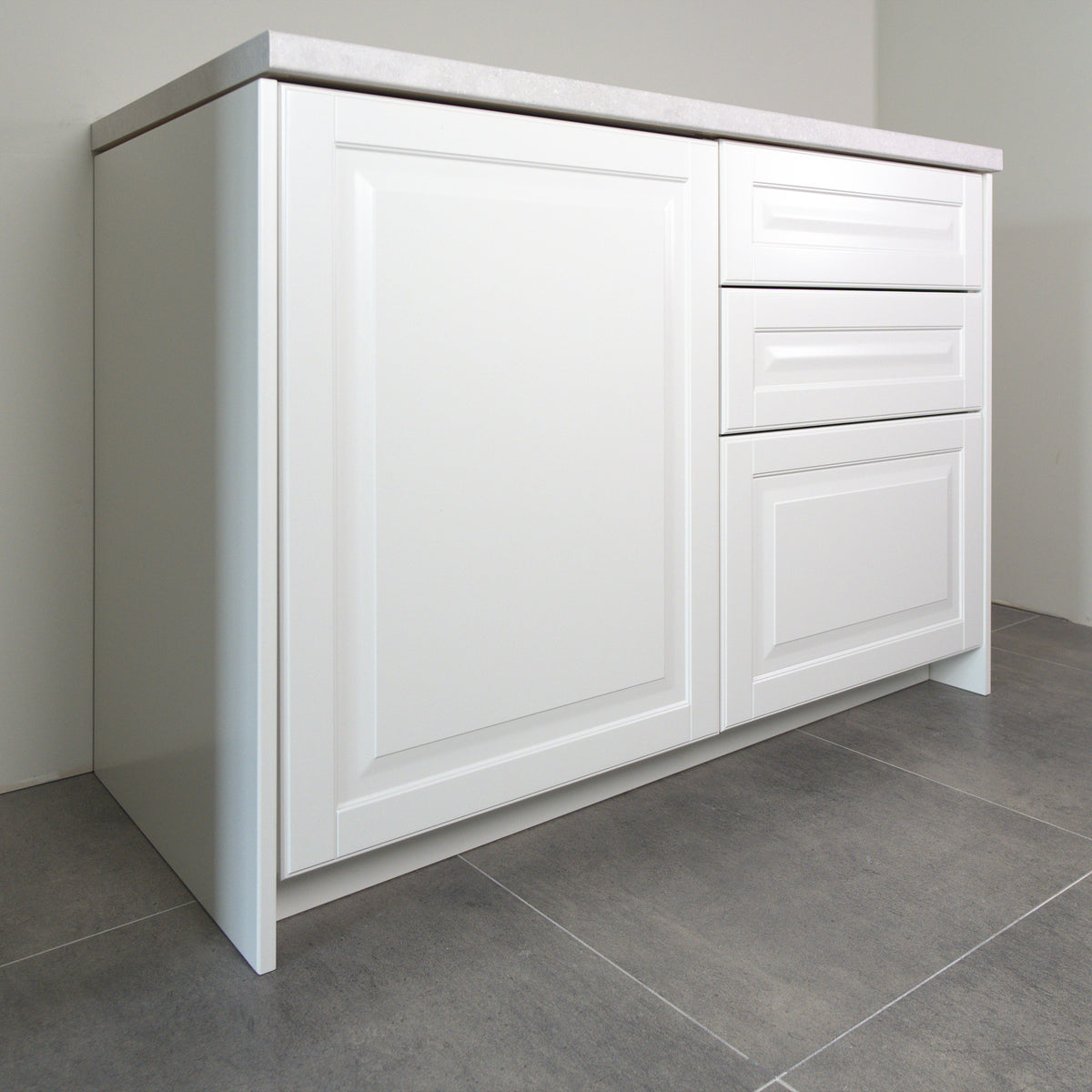 Vienna fronts in white lacquer on a kitchen cabinet, angled view from the left