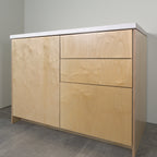 Birch plywood fronts on a kitchen cabinet, angled view from the right