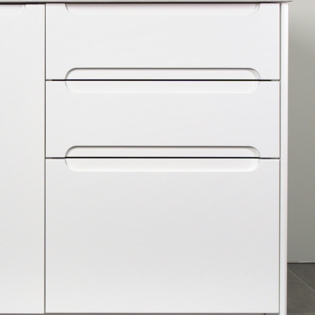 Three drawers with Grip fronts in white lacquer, handle pockets end before the sides of the front