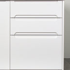 Three drawers with Grip fronts in white lacquer, handle pockets end before the sides of the front