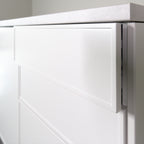 Pulled out drawer with a Linea front, showing the 19 mm front edge and the frame, white lacquer
